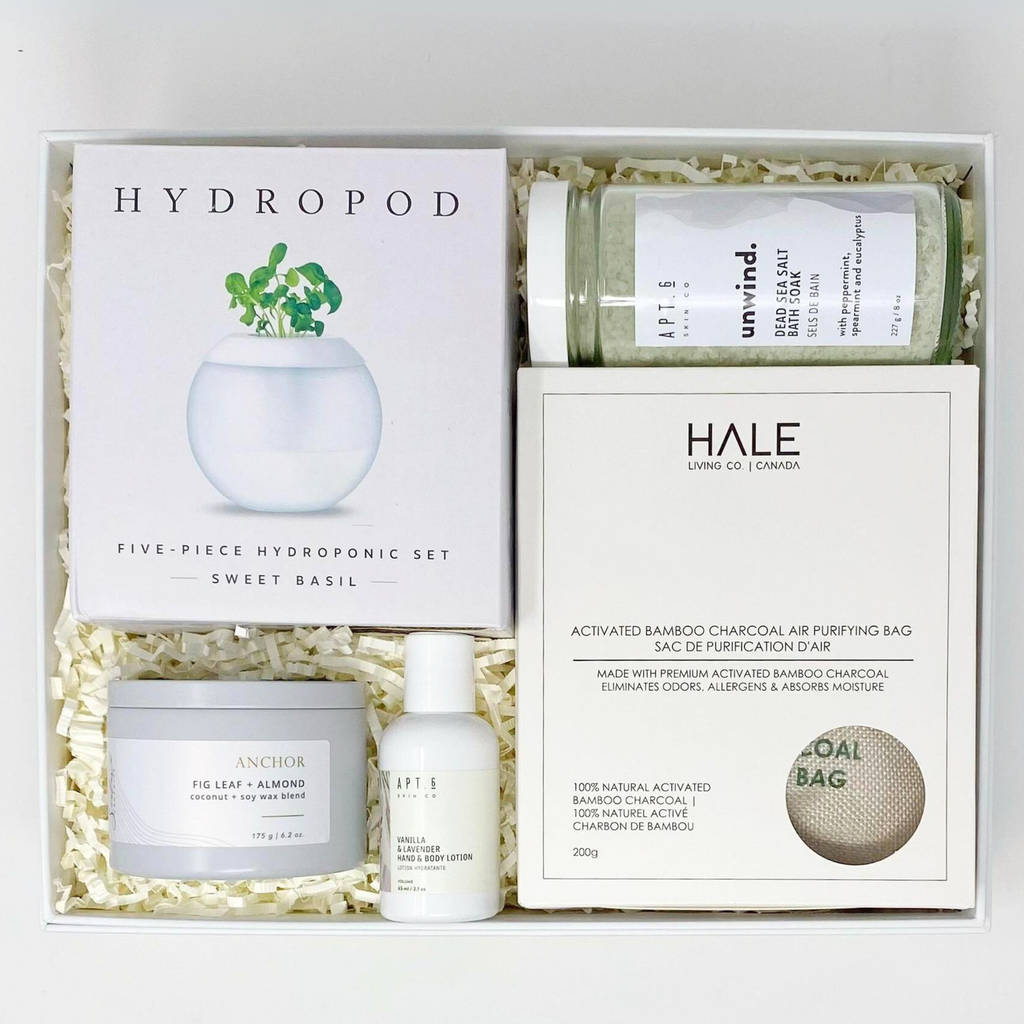 Sustainable gift box with Our Green House - Hydro Pod Planter Kit (Sweet Basil), Apt. 6 Skin Co. - Unwind Dead Sea Salt Bath Soak﻿, Apt. 6 Skin Co. - Vanilla Lavender Hand & Body Lotion, Sealuxe - Anchor Fig Leaf & Almond Candle, Hale Living Co. Canada - Activated Bamboo Charcoal Air Purifying Bag. Packaged in a recycled magnetic gift box